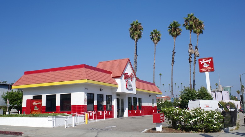 Tommy's exterior with palm trees