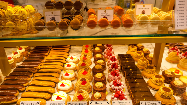 Pastries and macarons in a Paris boulangerie display counter