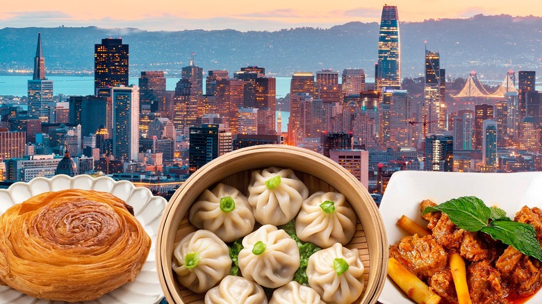 Pastry, dumplings, and meat dish against an image of the San Francisco sky line