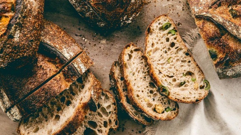 Sliced loaves of olive polenta sourdough bread from Jane the Bakery in San Francisco