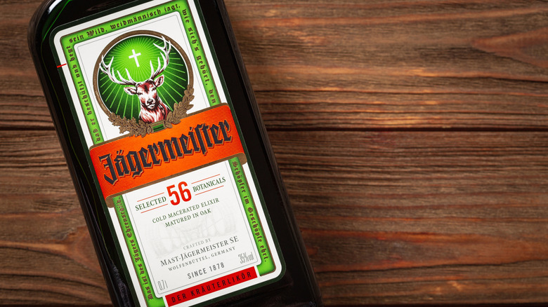 bottle of Jägermeister on a wooden backdrop