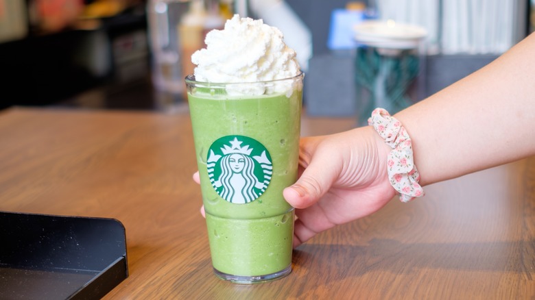 Starbucks matcha drink with whipped cream