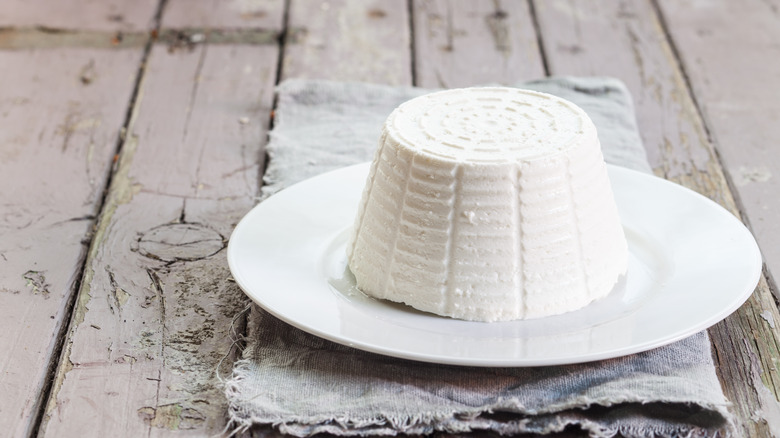 A lump of ricotta on a white plate