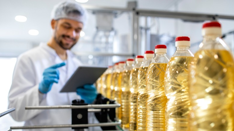 Bottles of vegetable oil at factory