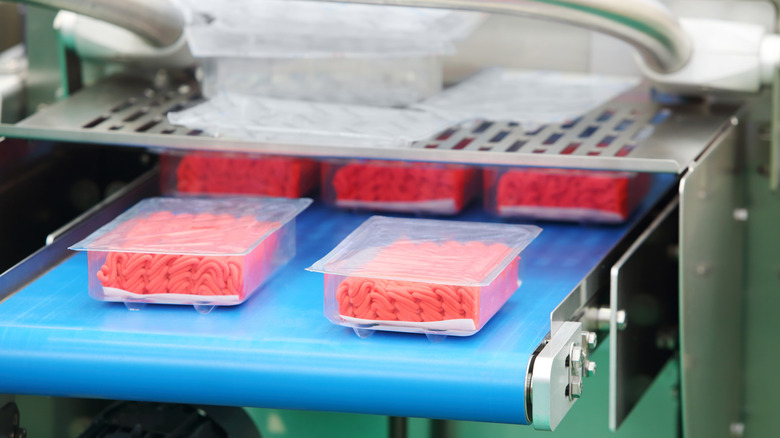 Mechanically separated meat being packaged on a machine