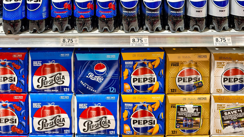 Various Pepsi flavors on a store shelf.