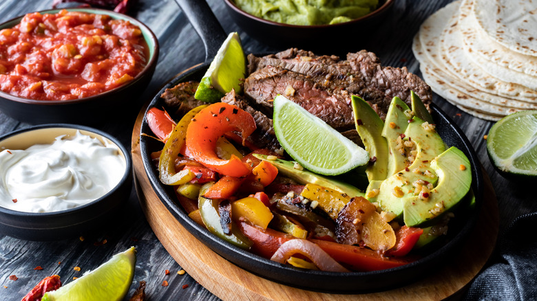 Closeup of fajita ingredients in a cast iron skillet