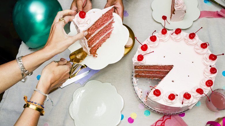 Pink cherry layer cake served at a party