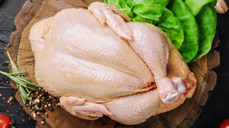 Thawing turkey on a wooden platter