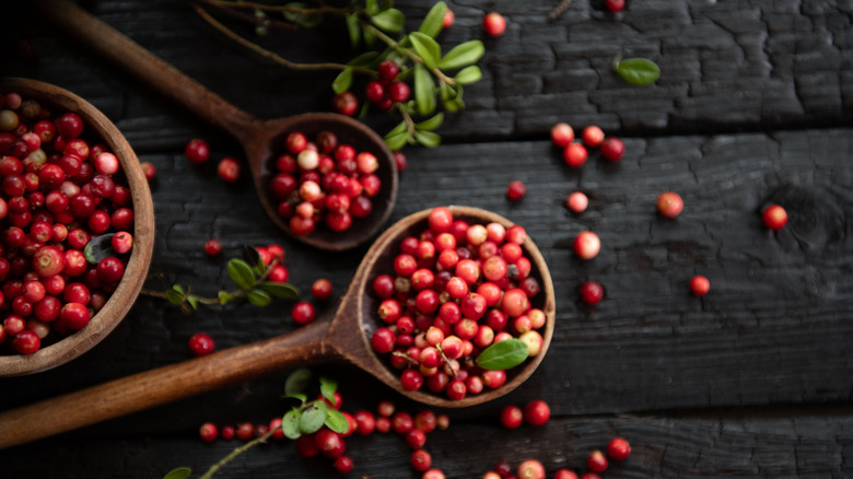 cranberries in wooden spoons