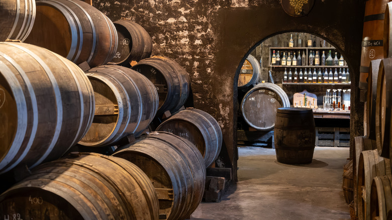 Cognac in barrels aging in a cellar in France