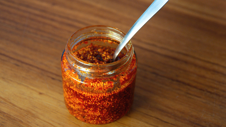 Chili crisp in a jar with spoon