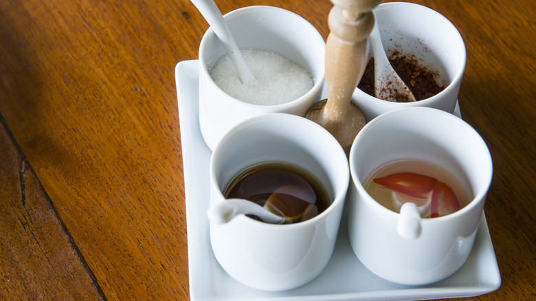 Four Thai condiments in bowls