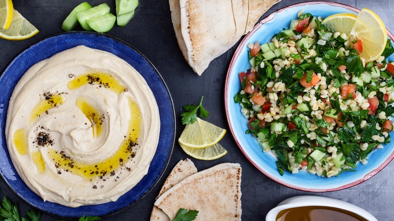 Lebanese hummus and salad with pita and cucumbers