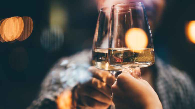 couple toasting with white wine