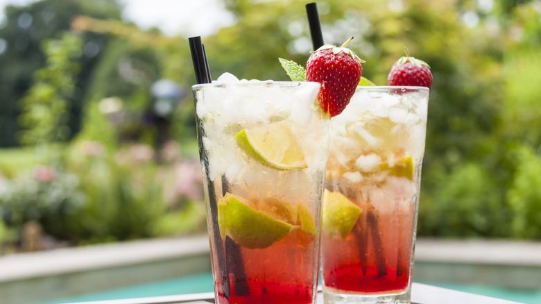 clinking wine glasses with straws