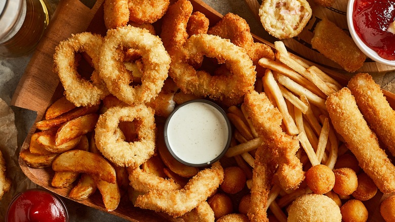 Overhead view of a variety of fried foods and sauces