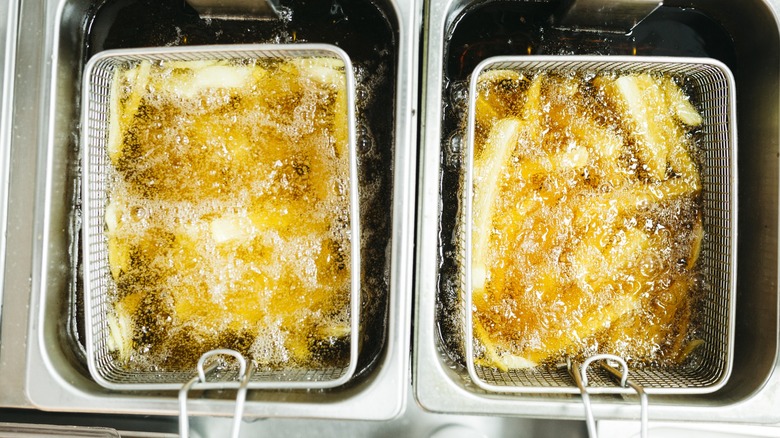 French fries cooking in commercial deep-fryer