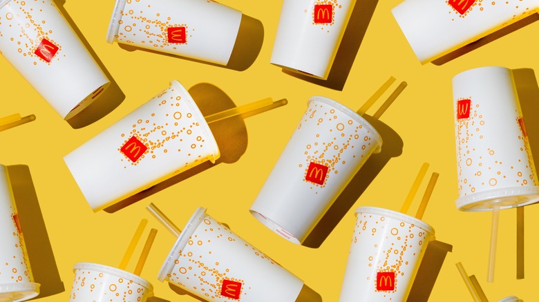 Cups of McDonalds soda yellow background