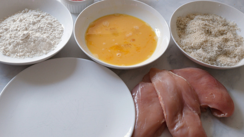 raw chicken breading station