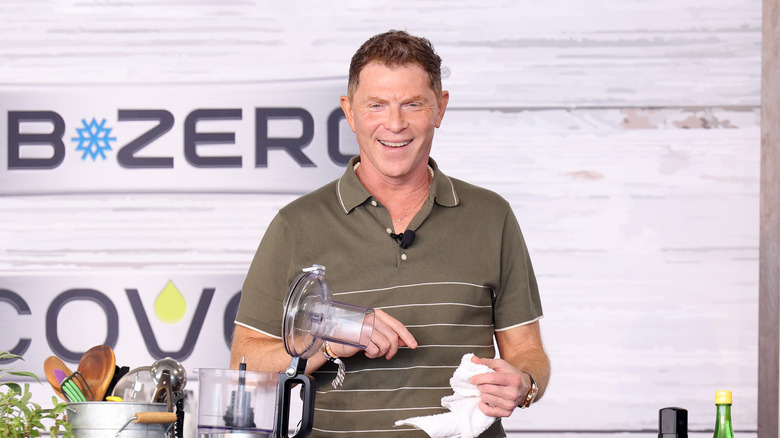 Bobby Flay smiling during cooking demo