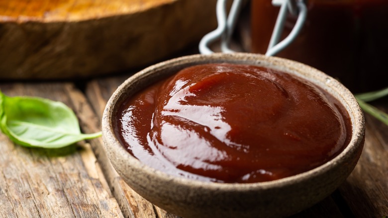 small container of BBQ sauce