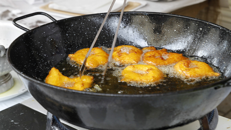 Deep frying cakes in pan