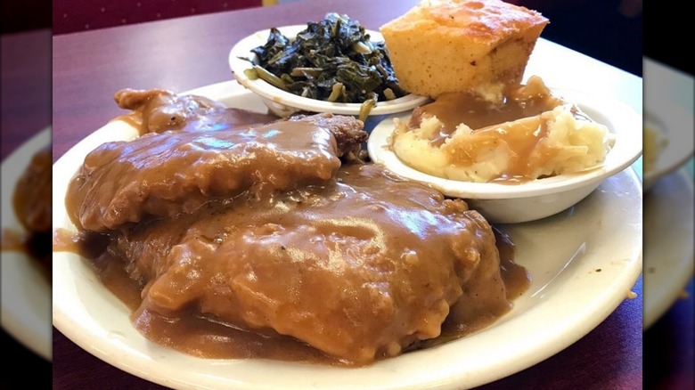 Chiken with gravy, mashed potatoes, collard greens, and cornbread at Kountry Cookin Soul Food Restaurant in Memphis