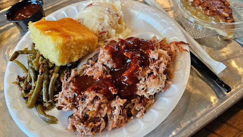 Pulled pork, cornbread, green beans, and mashed potatoes from Vernon's Smokehouse