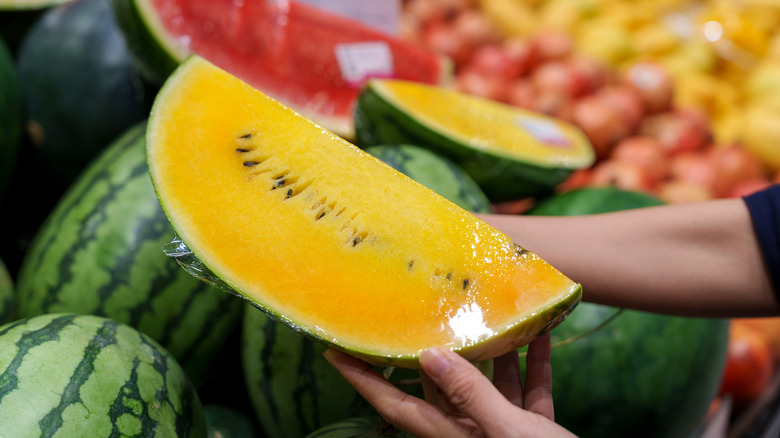 Yellow watermelon in plastic wrap