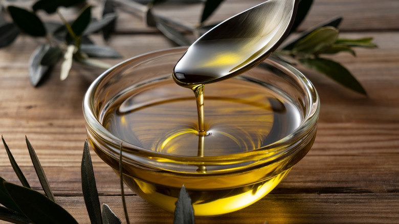 small bowl of olive oil and spoon