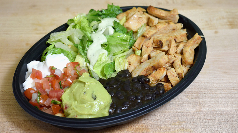 Taco Bell's Power Menu Bowl on a wooden surface