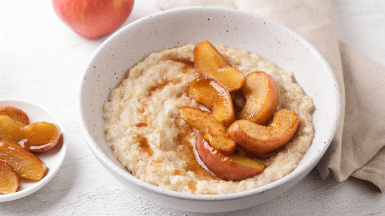 Bowl of oatmeal with apple slices