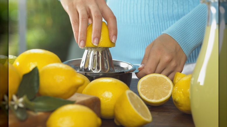 Woman juicing lemons