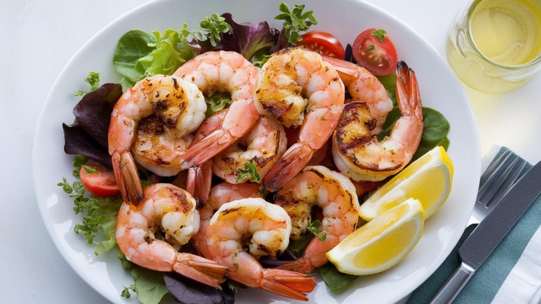 Plump grilled shrimp on salad