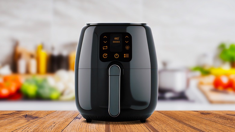 Air fryer on a wooden kitchen table