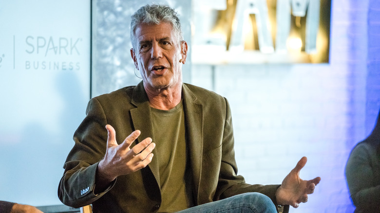 Anthony Bourdain seated and speaking