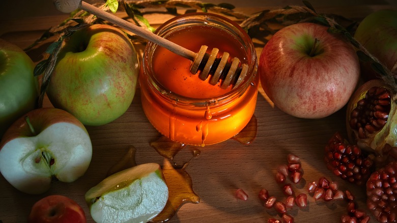 Apples, honey, and pomegranate seeds