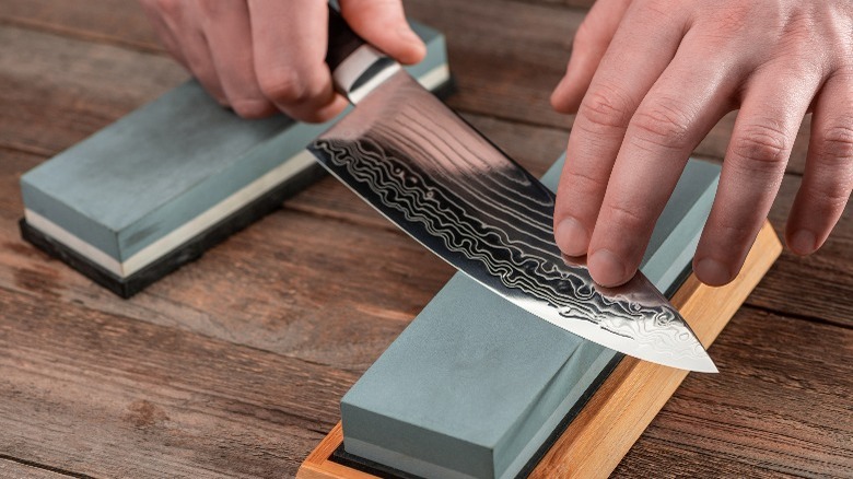 Someone sharpening Japanese knife