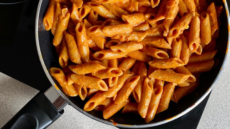 penne alla vodka in pan on stove