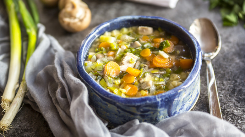 Chicken noodle soup in blue bowl