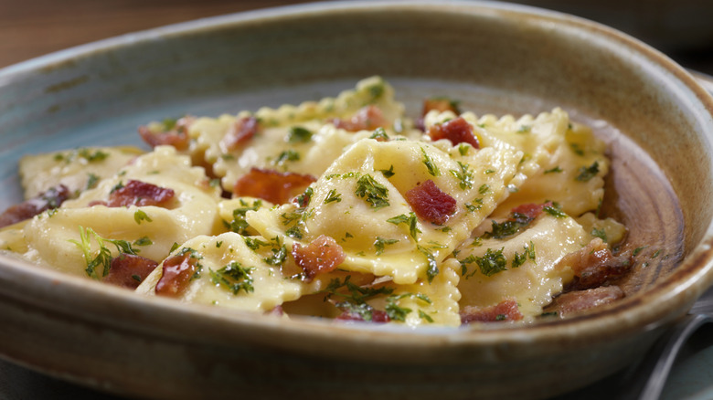 Lobster ravioli with bacon and herbs