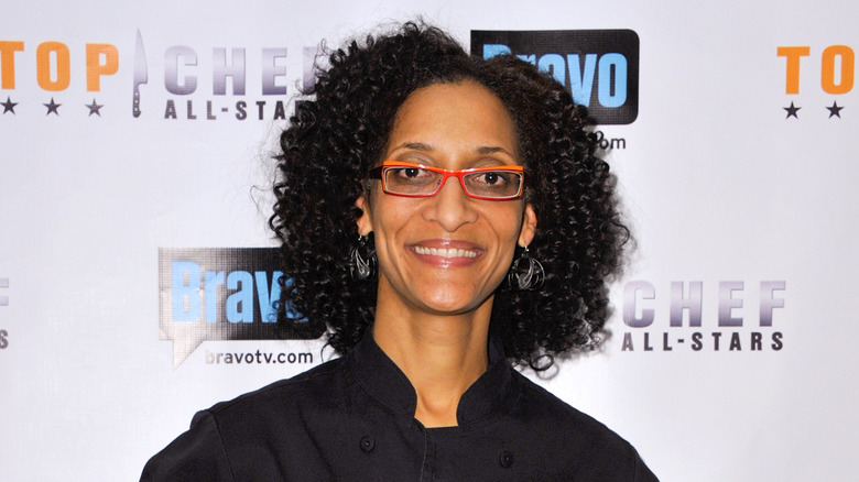 Carla Hall red dress and glasses