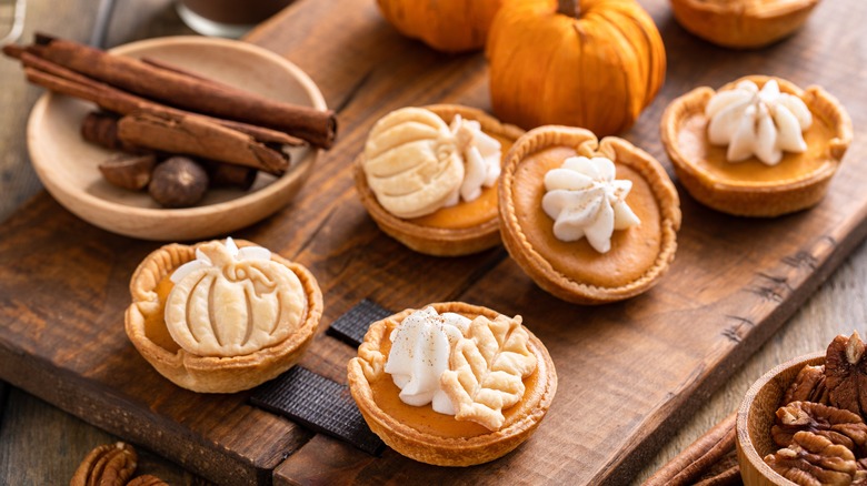 Miniature pumpkin pies with whipped cream