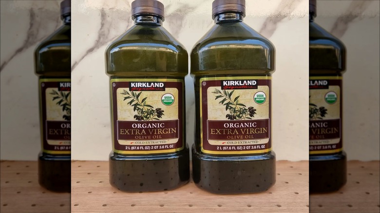 Two Kirkland olive oil bottles