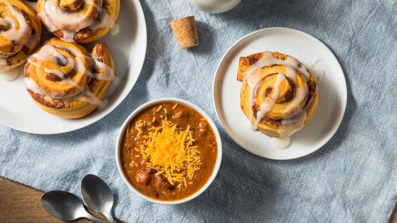 bowl of chili with plated cinnamon rolls