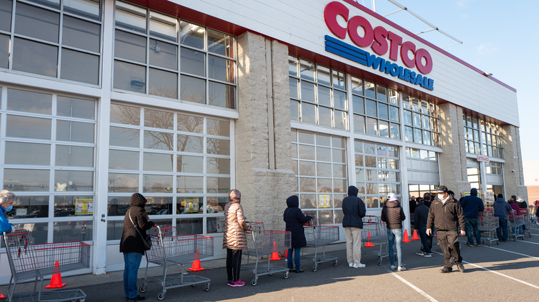 a line of people outside of Costco