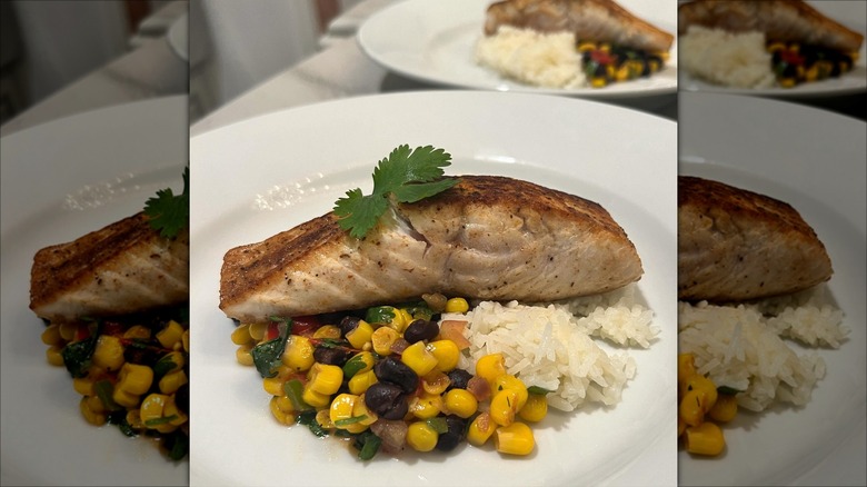 Cooked ivory king salmon with succotash and rice