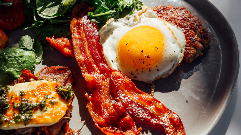 Bacon and eggs on plate