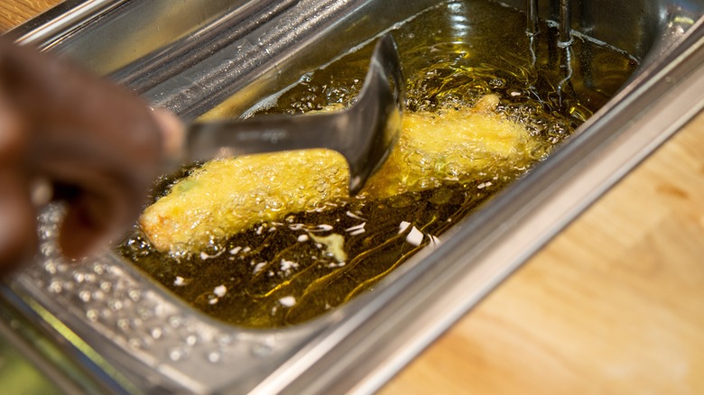 Fish frying in oil